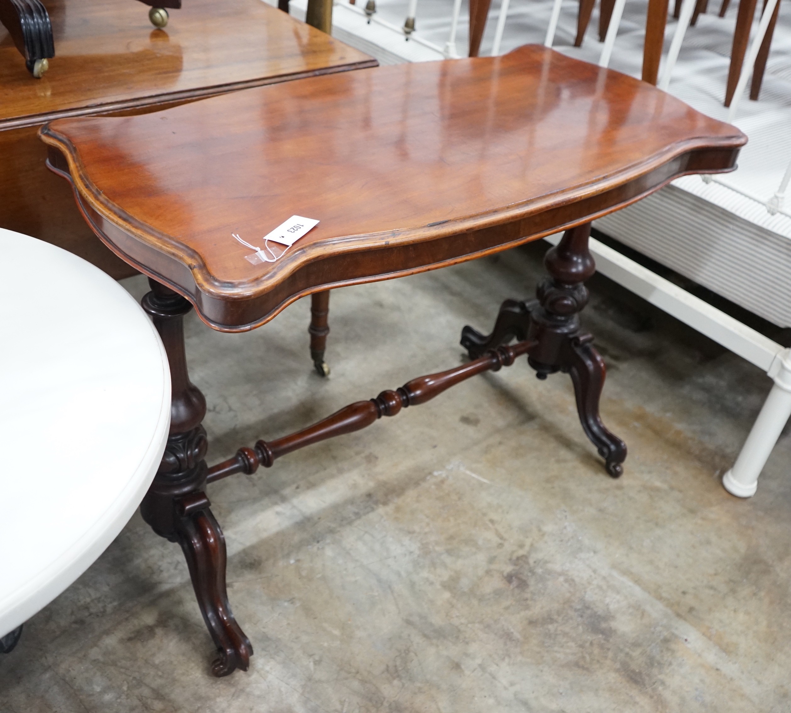 A Victorian mahogany stretcher table, length 106cm, depth 52cm, height 75cm